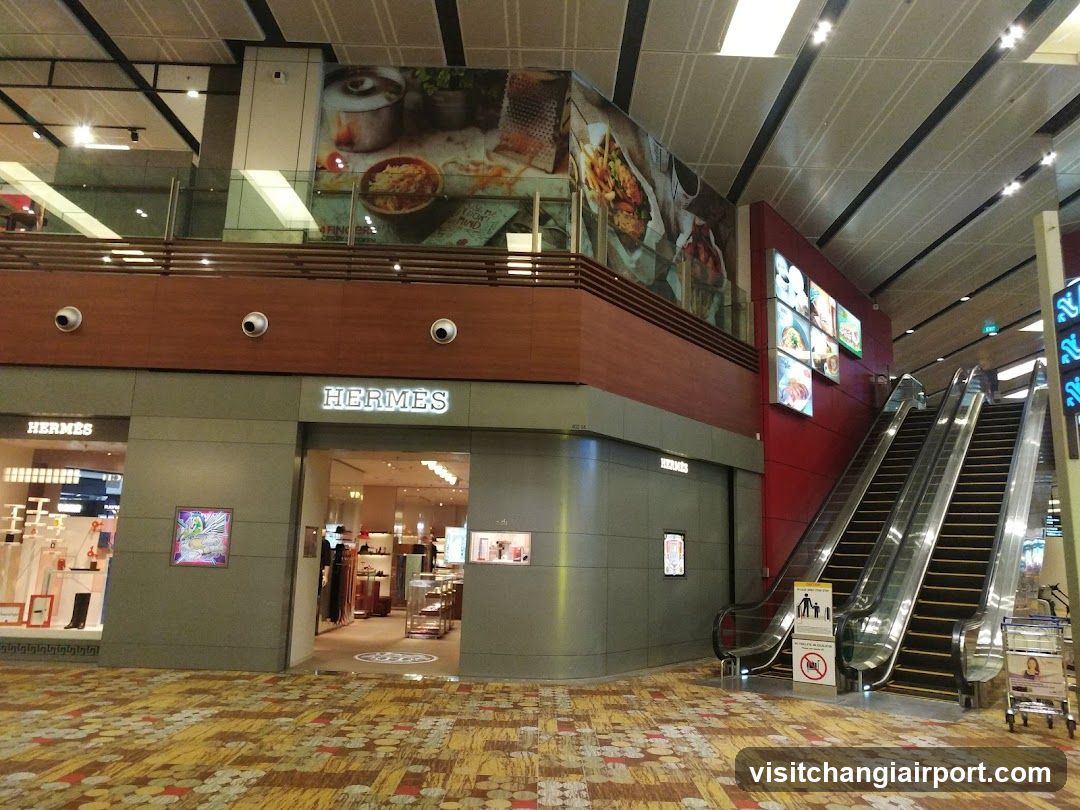 Shopping Mall Interior with Hermes Store and Escalators