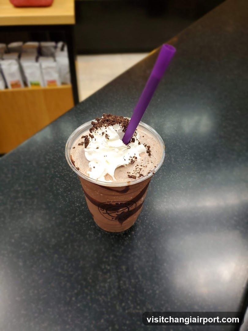 Chocolate Milkshake with Whipped Cream and Oreo Crumbs
