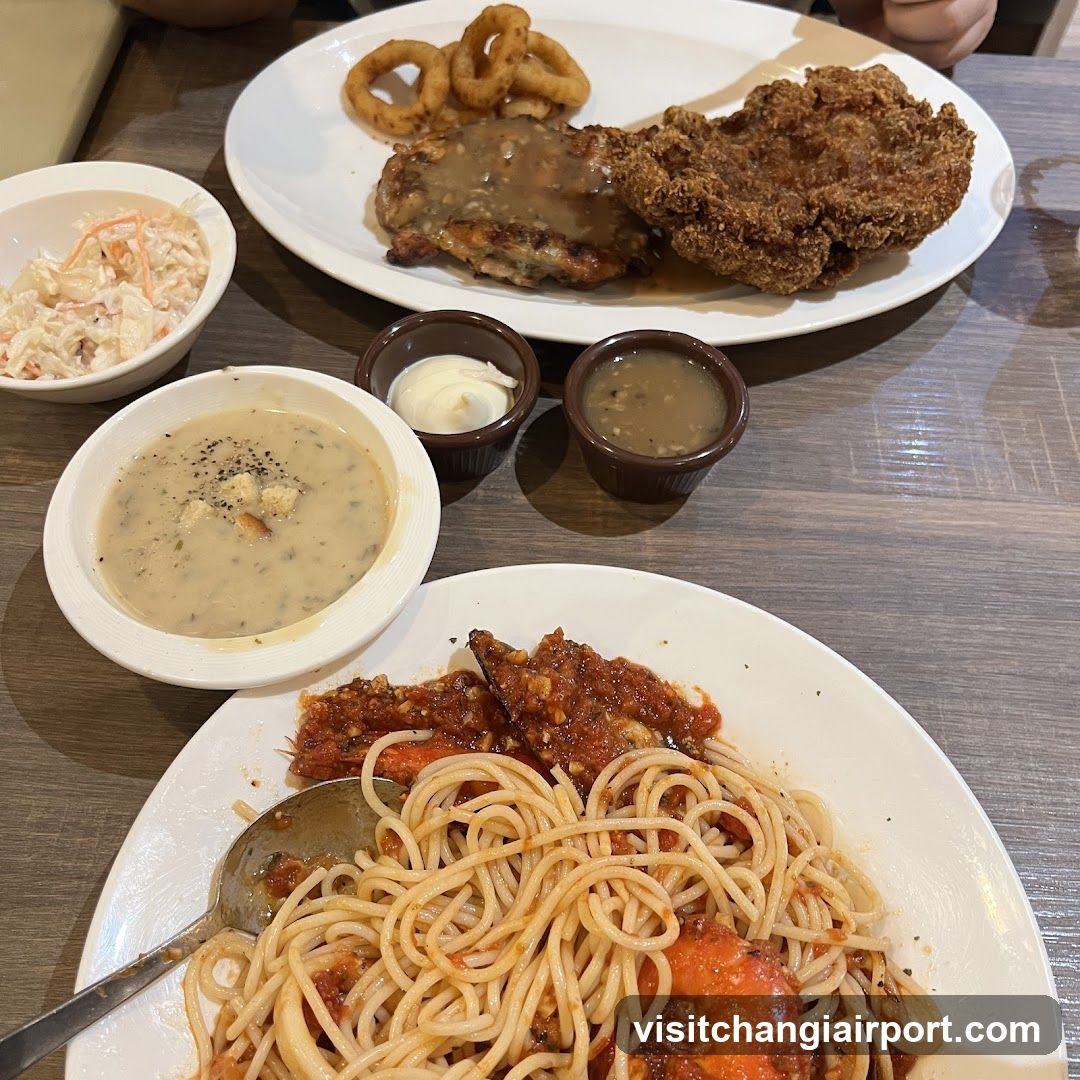 Dining Table Spread with Fried Chicken and Pasta