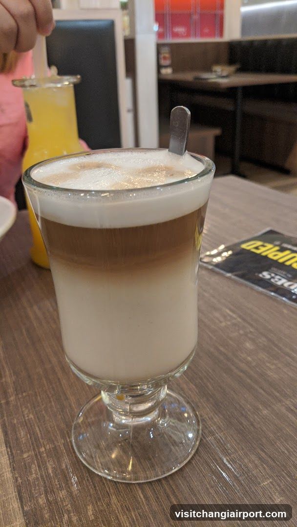 Latte in a glass cup at cafe