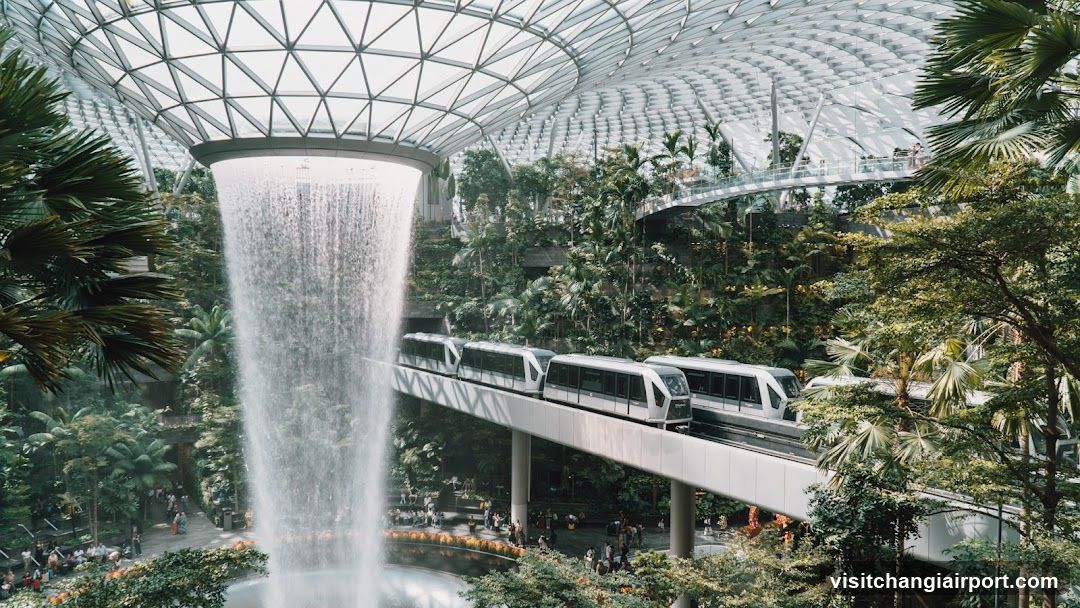 Indoor Waterfall and Monorail in Tropical Setting