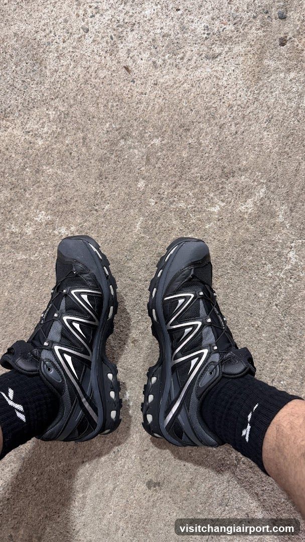 Salomon X Ultra 4 shoes on concrete floor