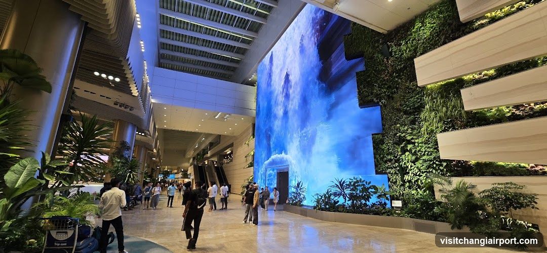 Airport Terminal Interior with Digital Art and Greenery