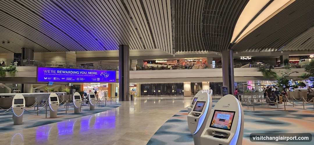 Airport Terminal Interior with Self-Service Kiosks and Digital Signage