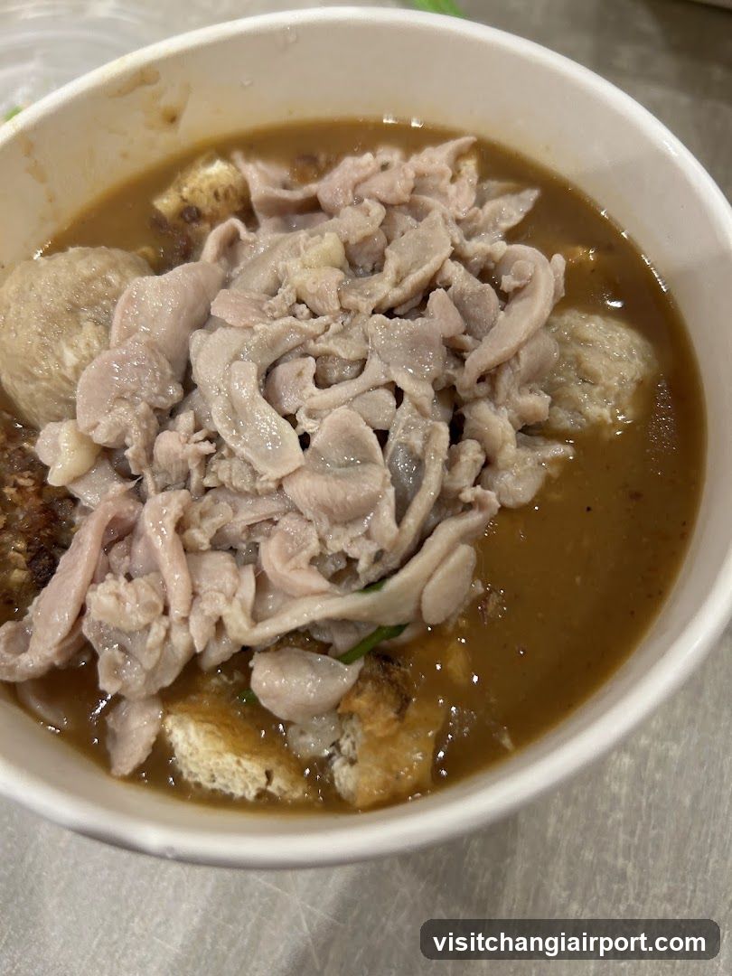 Bowl of Soup with Meat and Dumplings