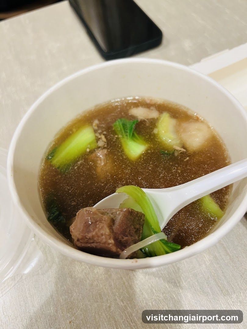 Bowl of Soup with Meat and Vegetables