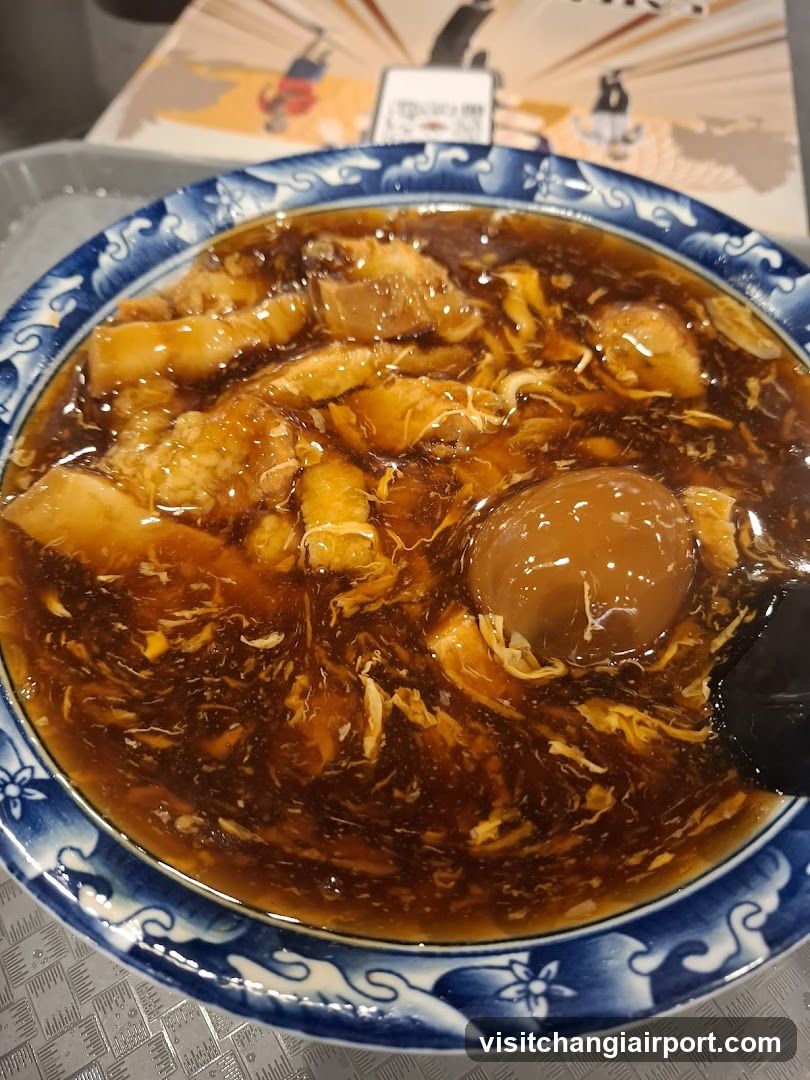 Bowl of Egg Drop Soup with Braised Pork and Boiled Egg