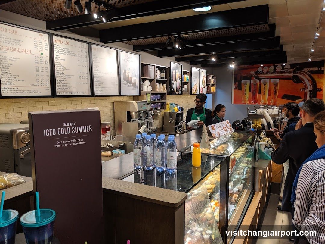 Starbucks Interior with Menu Boards and Customers