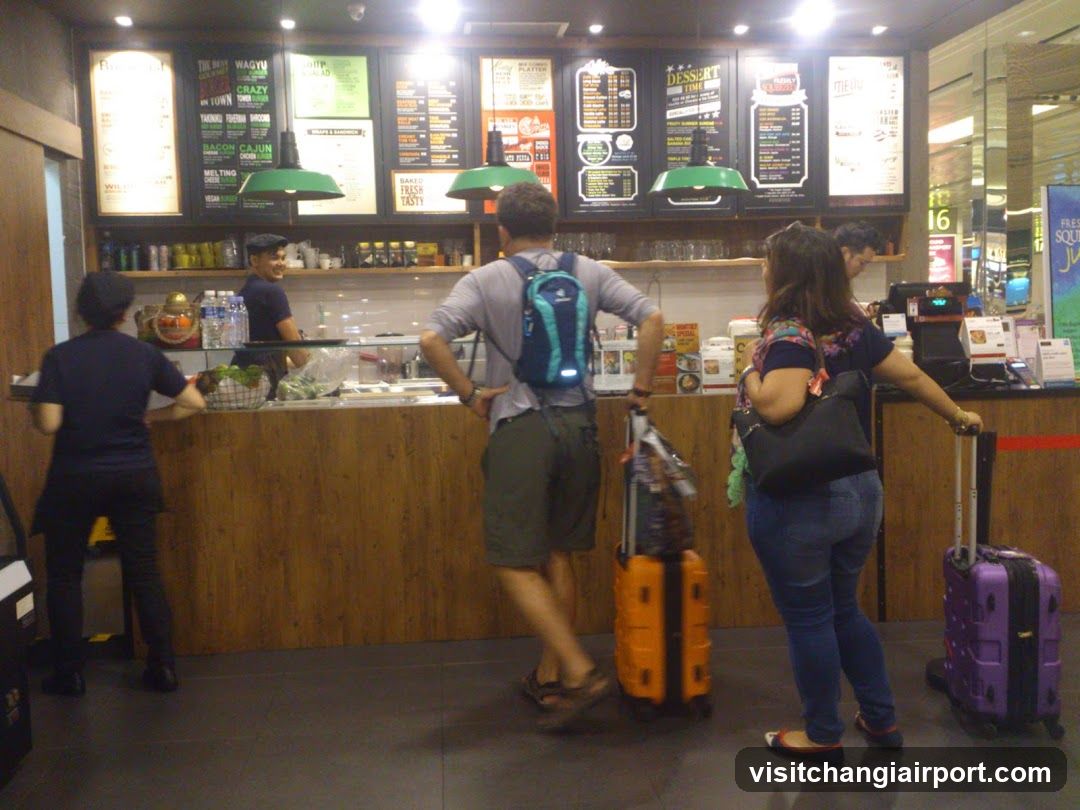 Customers at a coffee shop counter