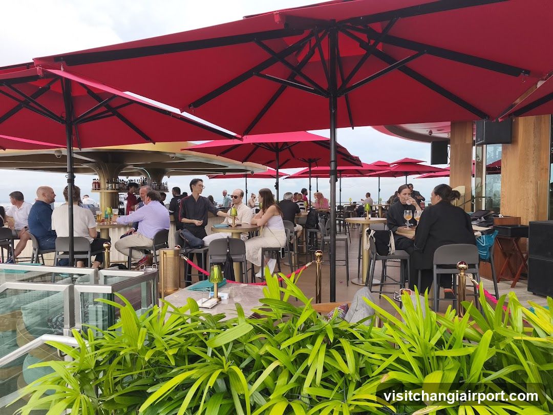 Outdoor Dining Area with Red Umbrellas