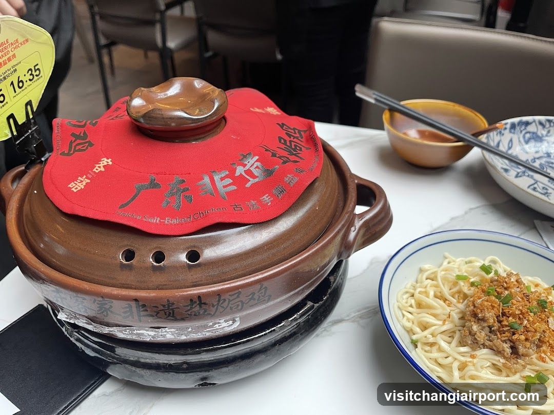 Dining Table with Salt-Baked Chicken Pot and Noodles