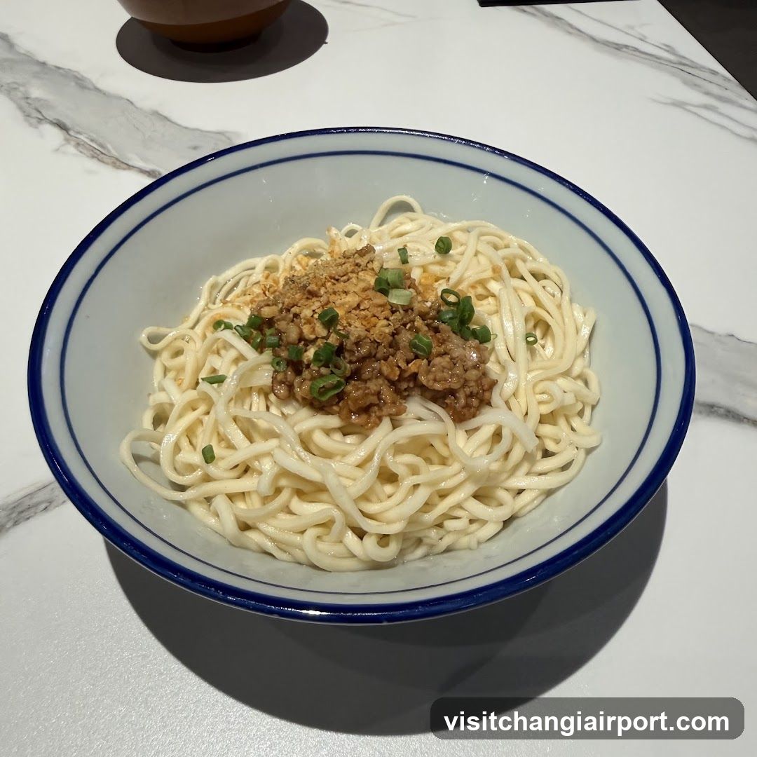 Bowl of noodles with minced meat and green onions