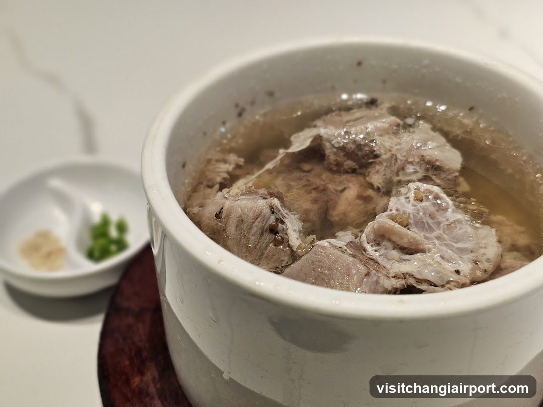 Bowl of Broth with Meat and Side Dishes