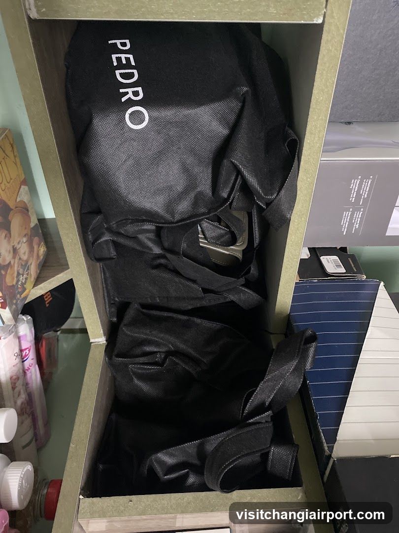 Shelf with black bags and boxes