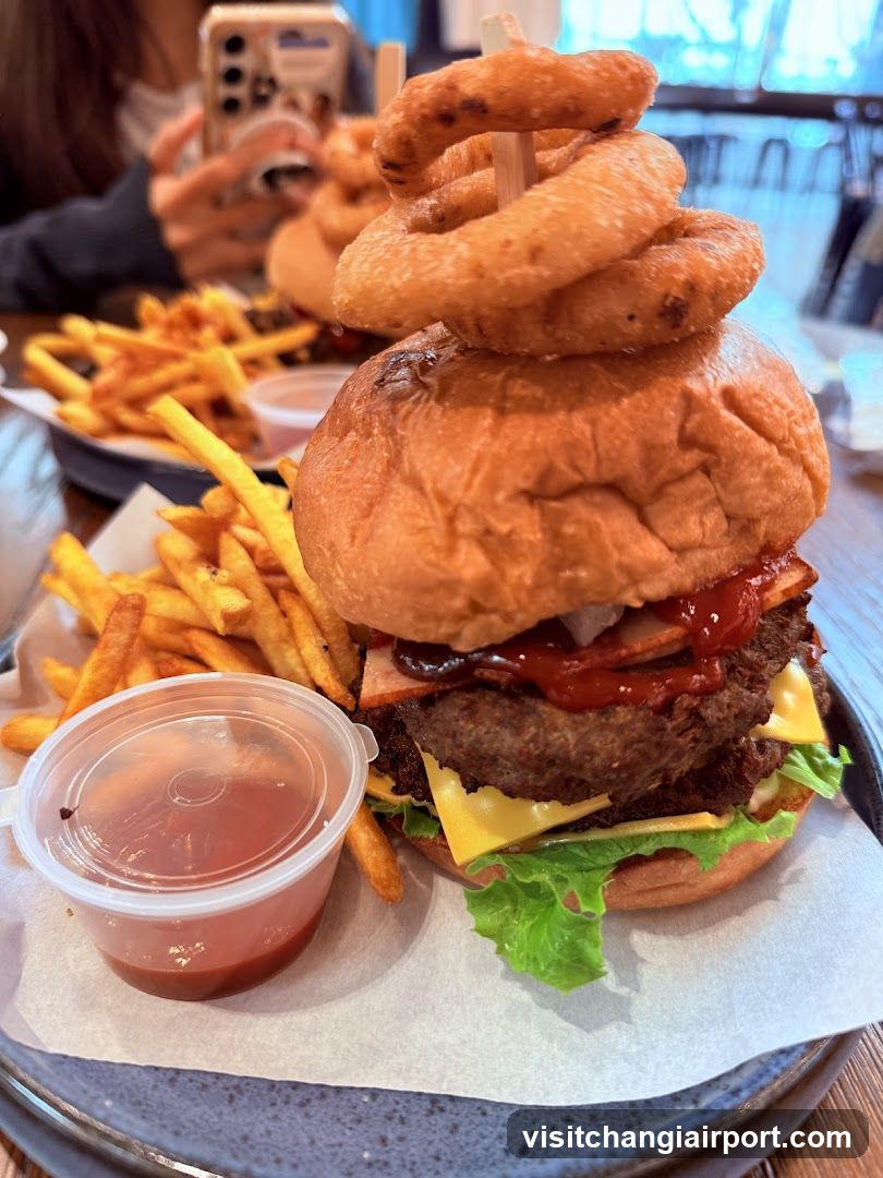 Loaded Burger with Onion Rings and Fries