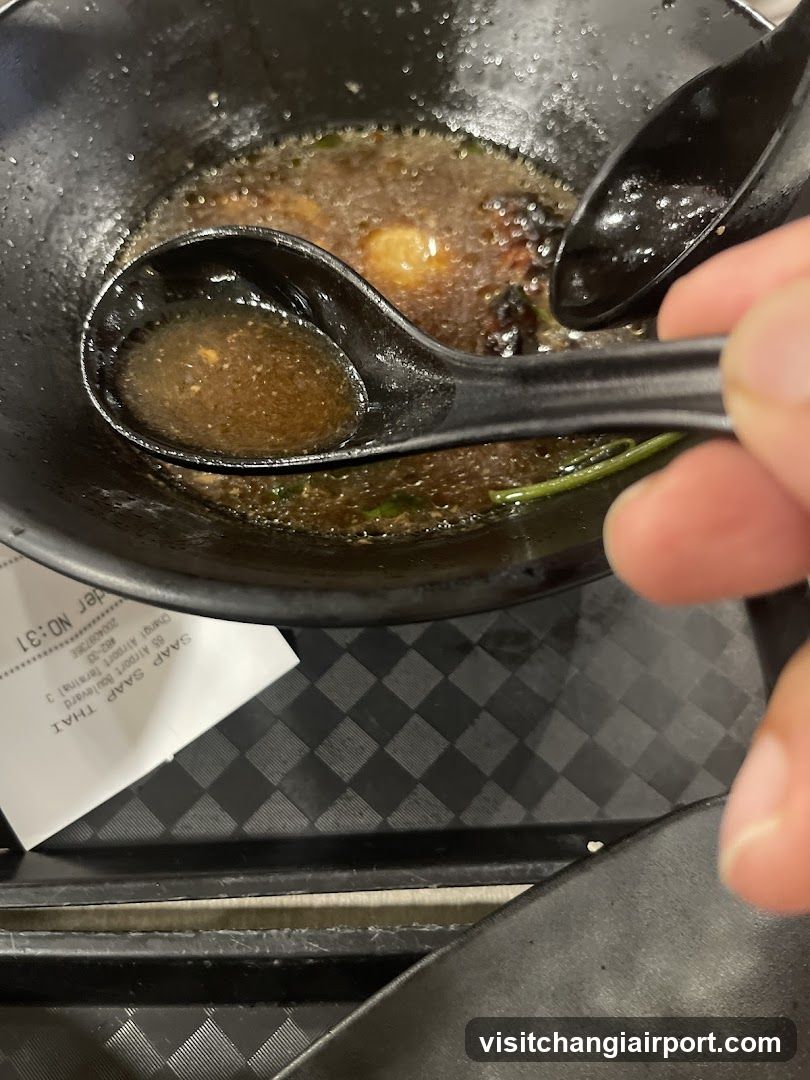 Bowl of Soup with Spoon
