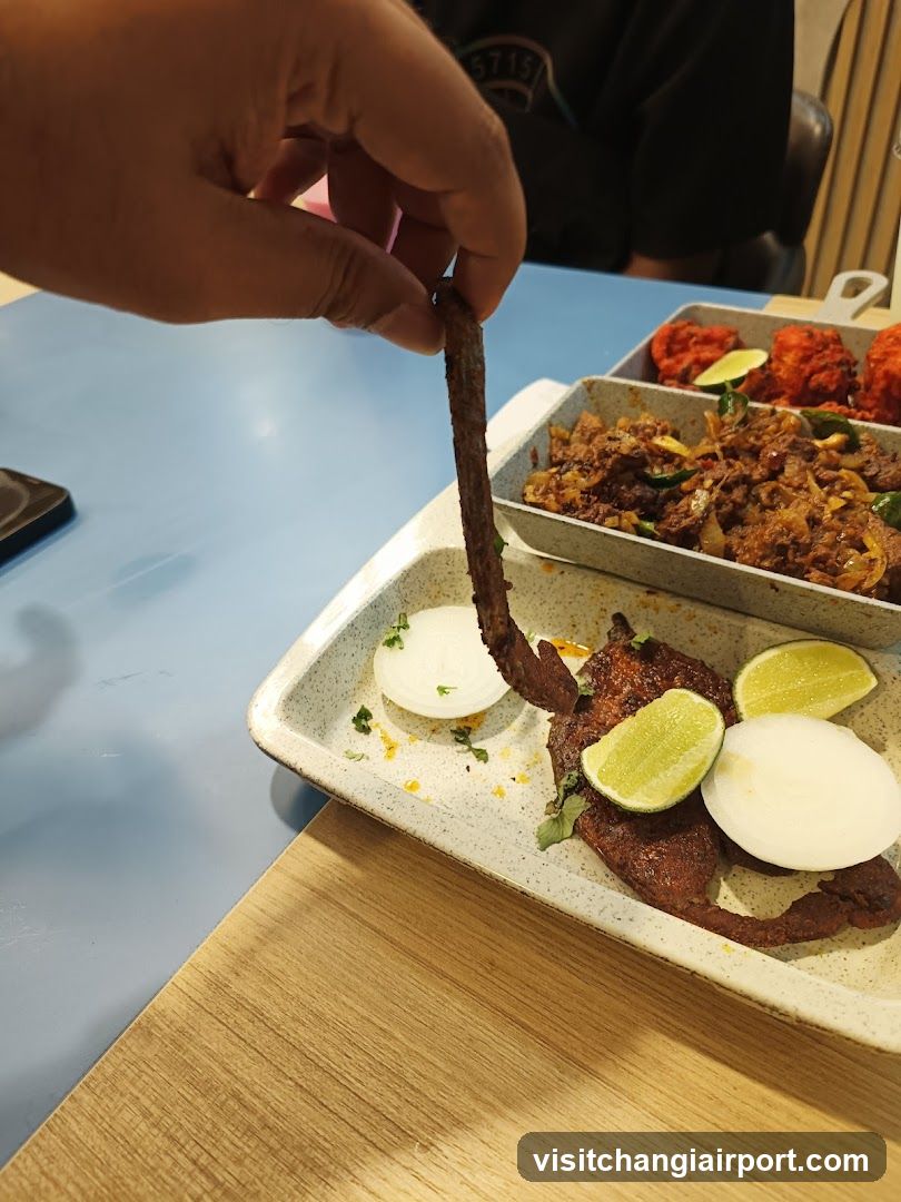 Food Dish with Hand Holding Meat Strip