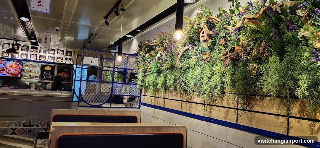 Interior of a restaurant with greenery wall