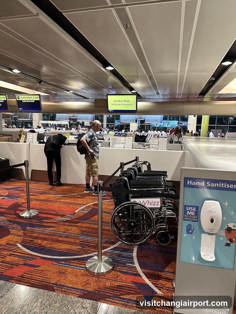 Airport Check-in Area with Wheelchairs and Hand Sanitizer Station