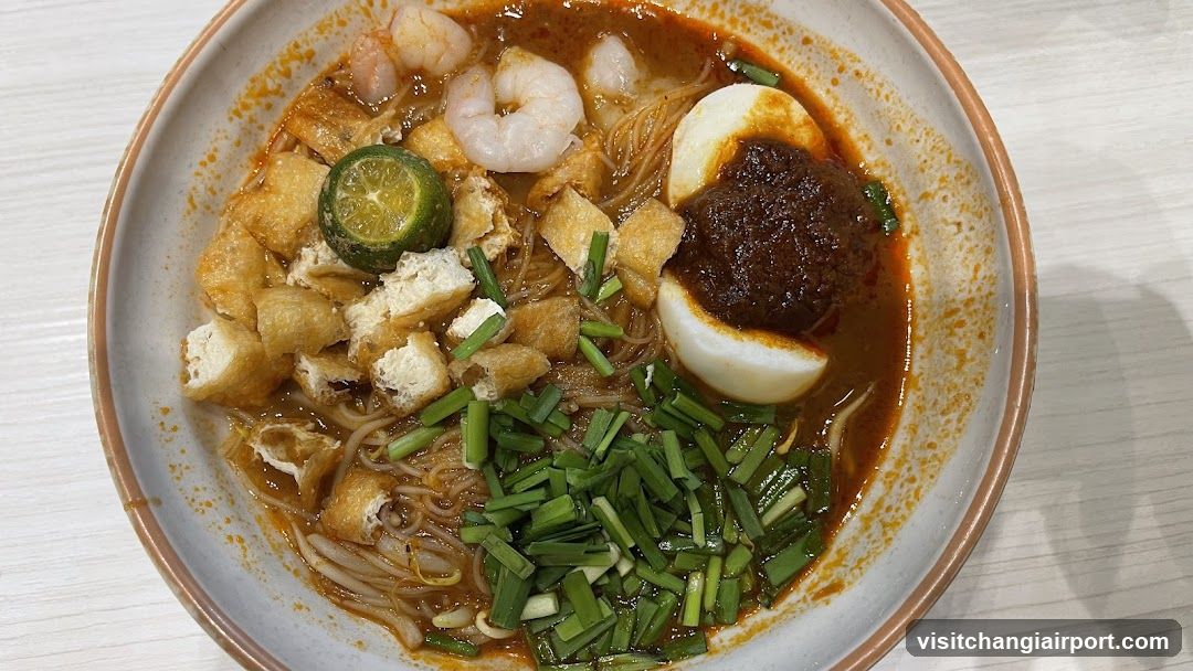 Spicy Noodle Bowl with Halved Egg and Chives