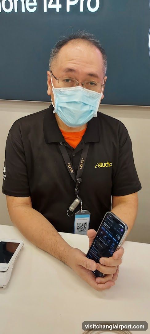 Staff with smartphone at store counter