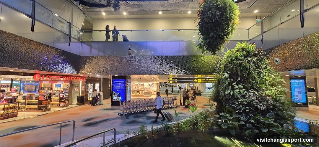 Airport Terminal Interior with Duty-Free Shop and Greenery