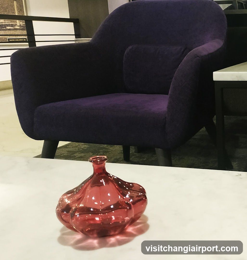 Purple Armchair and Red Vase