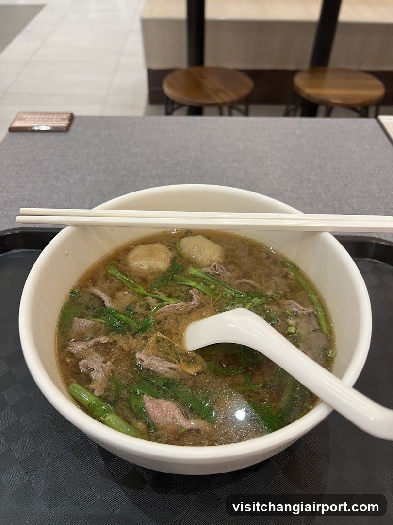 Bowl of Soup with Meat and Greens