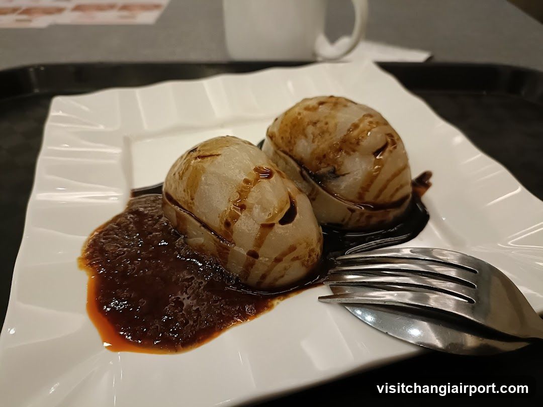 Sauced Dumplings on a Plate