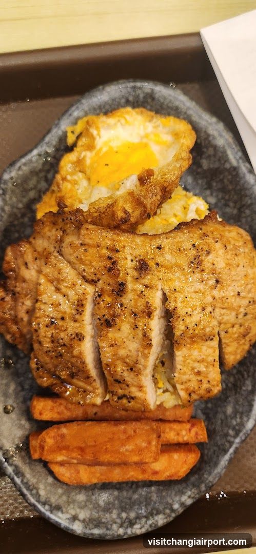 Pork Chop Meal with Sweet Potato Fries and Fried Egg