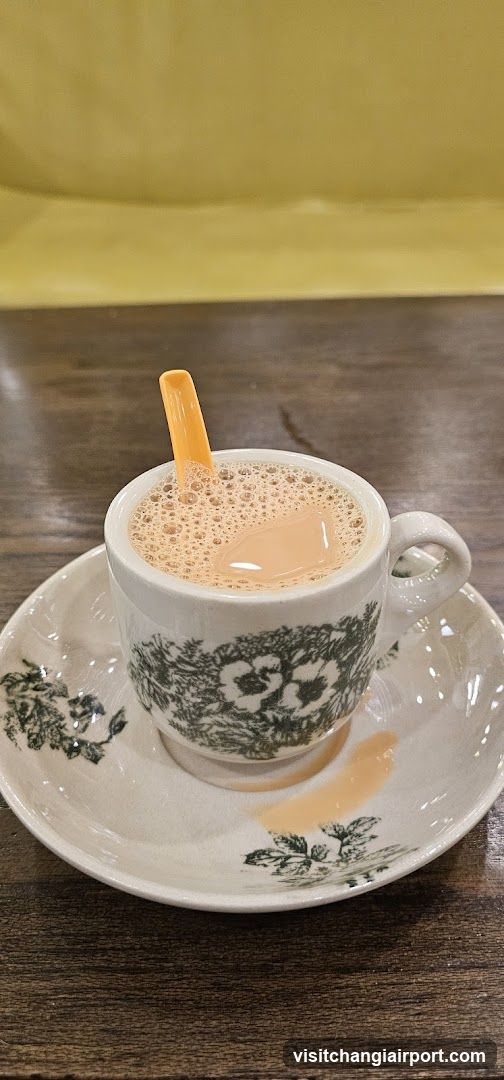 Cup of Tea with Orange Spoon