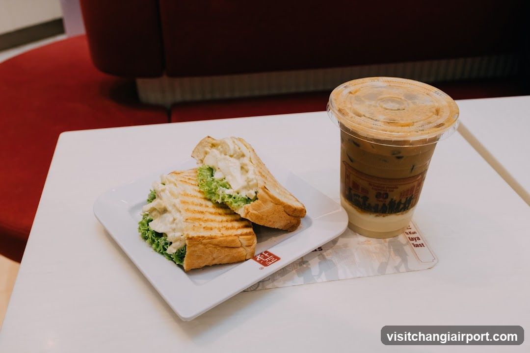 Sandwich and Iced Coffee on Table