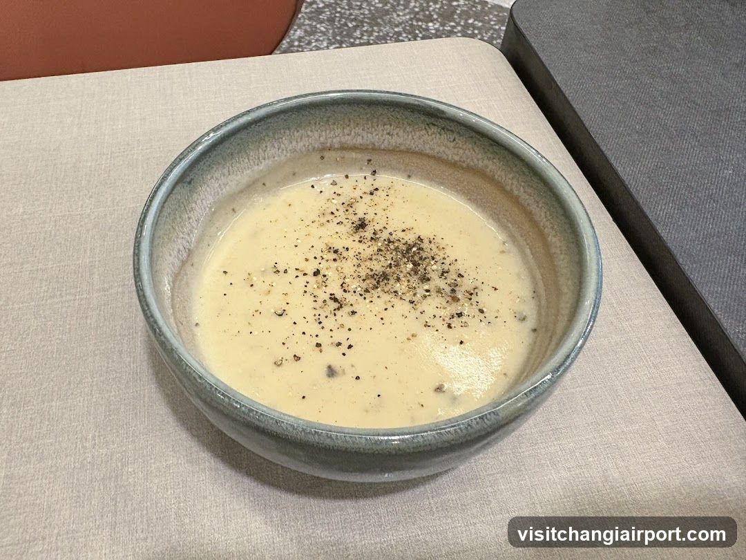 Bowl of creamy soup with black pepper