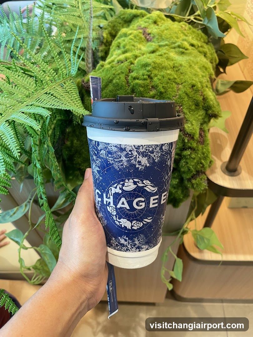 Chagee Coffee Cup with Greenery Background