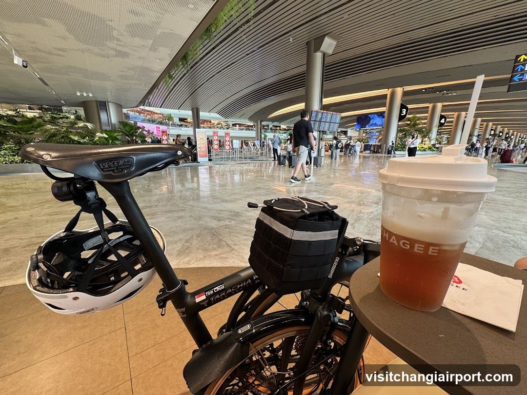 Airport Interior with Bicycle and Drink