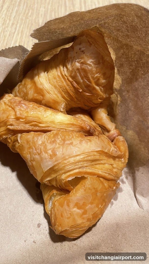 Croissant in Paper Wrapper