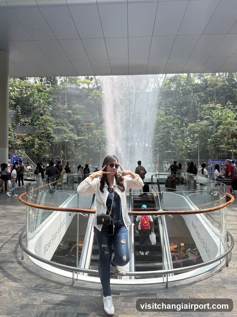 Woman posing in a modern atrium with fountain