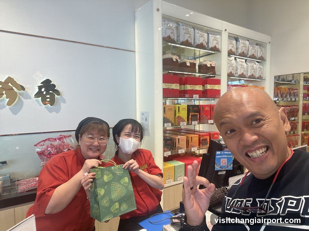Staff with Gift Bag in Store Interior