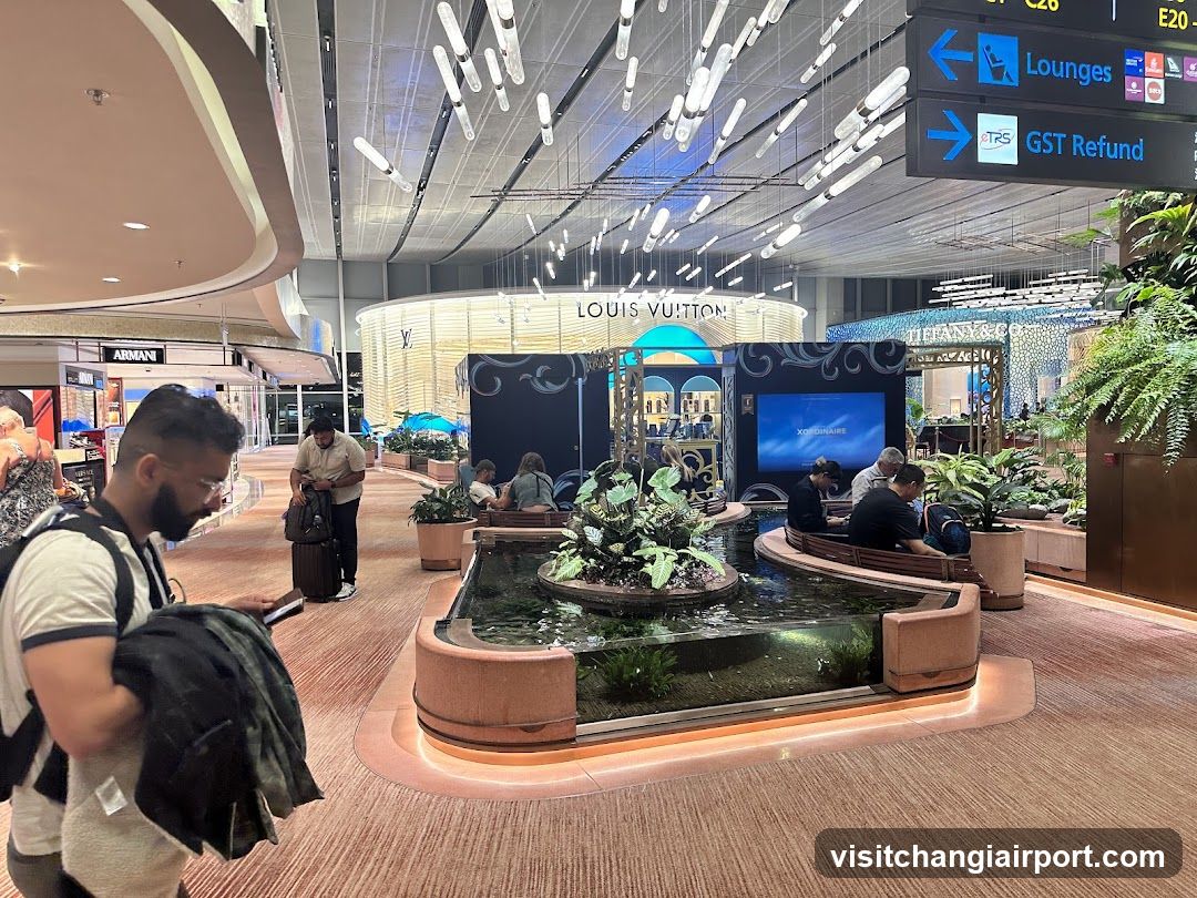 Airport Terminal Interior with Louis Vuitton Store and Water Feature