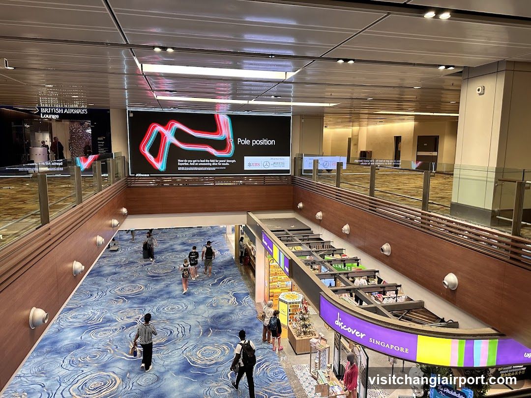 Airport Terminal Interior with Digital Display and Retail Area
