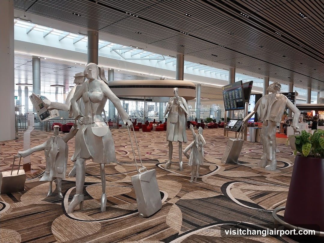 Silver Traveler Statues in Airport Terminal