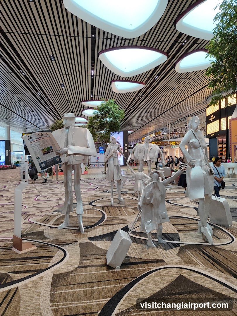 Traveler Sculptures in Airport Terminal
