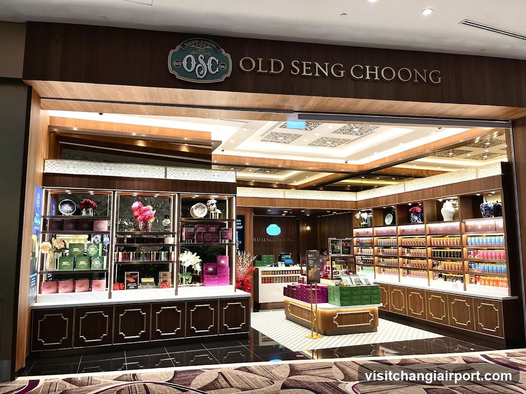 The image shows the storefront of Old Seng Choong, a shop with wooden signage and display shelves filled with various products.