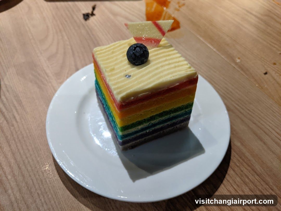 Rainbow Layer Cake Slice