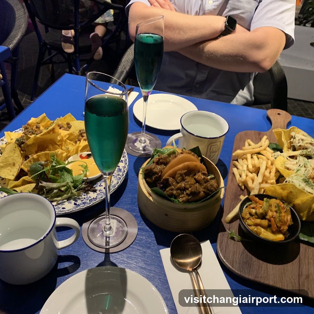 Blue Table Setting with Food and Drinks