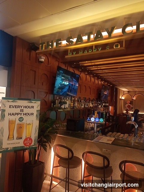 Bar Interior with Happy Hour Sign
