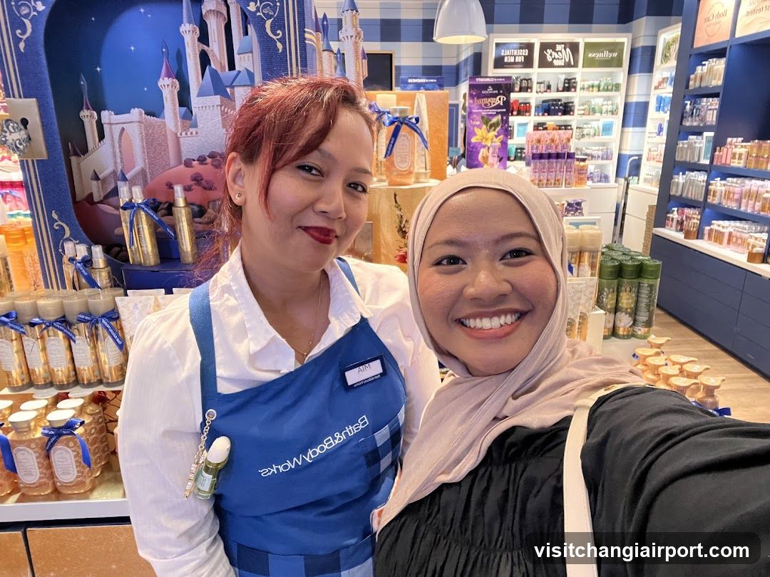 Staff and customer selfie in store