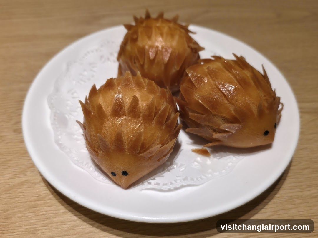 Hedgehog-shaped pastries on a white plate