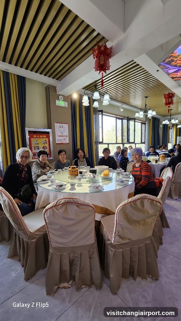 Dining Room Interior with Group Seated at Round Table