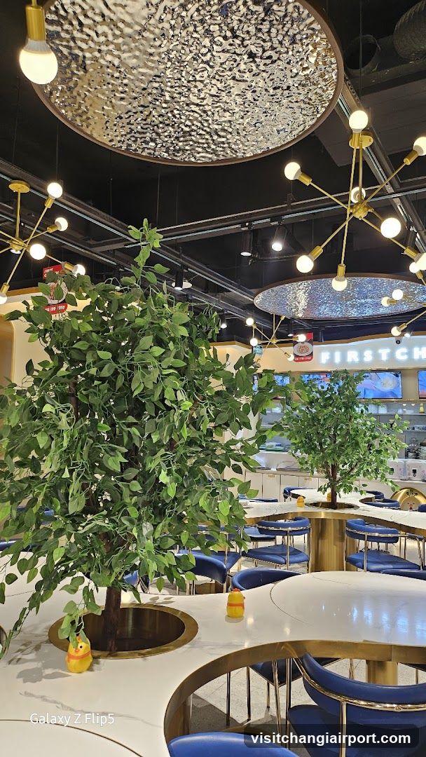 Modern Restaurant Interior with Decorative Lighting and Greenery